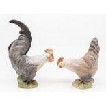 A pair of Royal Copenhagen models of a cockerel and a hen with printed and painted marks to base and