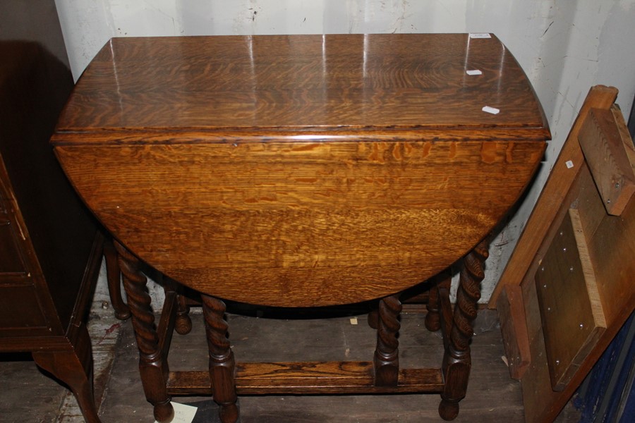 An Edwardian mahogany music cabinet, fitted with four drawers with fall fronts, together with an oak - Image 3 of 3