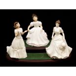 Three Royal Doulton figures, comprising Harmony HN4096, Amanda HN3635 and Welcome HN3764, all in