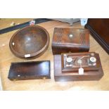 A collection of treen, comprising a turned elm bowl, an inlaid writing box, AF, an ink stand, fish