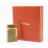 A cased St.Dupont Paris cigarette lighter, yellow metal with black lacquer 'Laque de Chine' stripes,