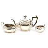 An Edwardian silver three piece tea service comprising teapot, sugar bowl and milk jug, oval