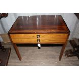 A late 20th Century rosewood veneered sewing table, with two drawers, containing a large