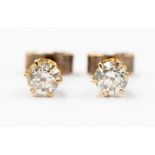 A pair of 9ct gold and diamond solitaire stud earrings, comprising brilliant cut diamonds, claw set,