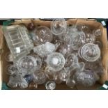 A collection of cut and moulded glass wares including jelly moulds, dishes, decanters and wine/