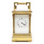 A French gilt brass carriage clock, the five-glass case with corner Corinthian pilasters and bracket