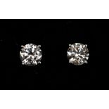 A pair of diamond and 18ct white gold stud earrings, the diamonds weighing a total approx. 1.