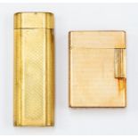 Cartier- a gilt metal Cartier lighter, lozenge form with engine turned decoration, length approx.