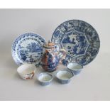 Seven 18th century Chinese Export pieces, Two Blue and White Plates, One Polychrome Cream jug and