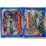 A large collection of costume jewellery comprising over 100 various bead necklaces, mostly 20th