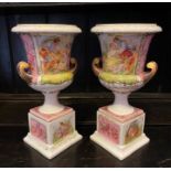 A pair of German porcelain campana vases, colour-printed of a caughting couple. 30cm H