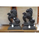 A pair of 19th Century cast iron fire lions, painted black