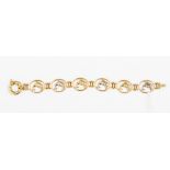 A 15ct gold bracelet, each open link set to the centre with a dolphin, alternate white and yellow