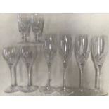 A set of six Royal Doulton cut glass champagne flutes and various other drinking glasses