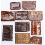 Ten various Edwardian silver mounted and other crocodile gentleman's wallets. (10) Condition: