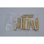 Twelve various vintage ivory and bone-handled folding pocket knives. (12)