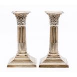A pair of George V silver Corinthian column candle sticks, by Hawksworth Eyre & Co, Sheffield