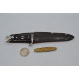 A REPRODUCTION Nazi Hitler Youth dagger, the 5.5" blade engraved with the motto 'Blut und Ehre', the