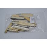 Twenty various vintage ivory and bone-handled folding pocket knives. (20)