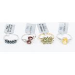 A collection of 9ct yellow and white gold gem set rings to include a yellow gold,  green apatite