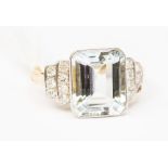An aquamarine and diamond dress ring, the rub-over set emerald cut aqua weighting approx. 4carats,