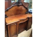 Victorian mahogany side board with back, serpentine front, two side cupboards with a central