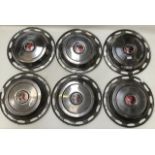Six vintage wheel hubs with world map in centre, Triumph 1300, 13” diameter.