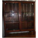 An early 19th Century mahogany bookcase top, raised on later bracket feet (likely to have originally