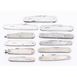 An assembled group of eleven Edwardian and later silver pocket knives, all with engine-turned