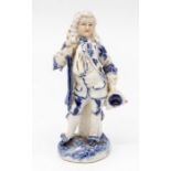 A 19th Century Continental blue and white figure of a Gentleman with staff (damaged), no: 1432