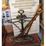 Cast iron walking stick stand with five walking sticks