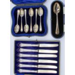 A collection of cased silver flatware to include: A set of six Edwardian engraved tea spoons, with