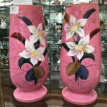 A pair of pink vases with hand painted decoration (2) Height approx 28.5cm Condition: Minor chip