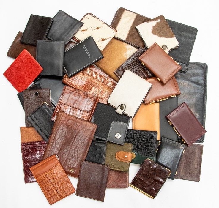 A collection of recent and vintage leather and crocodile Gentleman's accessories, including wallets,