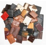 A collection of recent and vintage leather and crocodile Gentleman's accessories, including wallets,