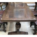 A Jacobean style oak draw-leaf dining table, raised on cup and cover supports, 74cm high, 137cm