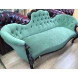 A Victorian walnut button backed settee, green upholstered, together with a pair of Victorian