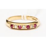 A  ruby and diamond set 18ct gold seven stone half eternity ring, set with alternate round cut