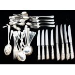 A collection of silver flatware to include: a part Elizabeth II hanovarian with rat tail dinner