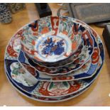 A collection of 19th Century Japanese Imari iron re plates comprising: pair of chargers; two dishes,