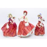 Three Royal Doulton lady figures 'Christmas Morn' HN1992, 'Christmas Day' HN4214 and 'Autumn