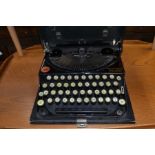 An early 20th Century American Remington portable typewriter in fitted case