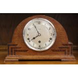 A John Bull of Bedford oak Art Deco mantle clock, having a single winder hole
