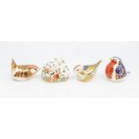 Four Royal Crown Derby paperweights to include; Robin with a silver stopper, Wren with silver