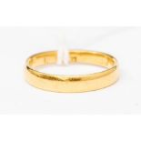 A 22ct gold wedding band, width approx. 3mm, marks rubbed, probably 22ct gold, ring size L, weight