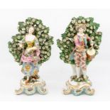 A pair of 19th Century Samson Derby figures of a Drummer and Maiden on scrolling stands with