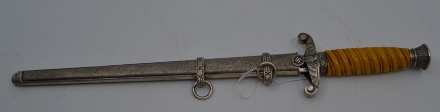 A REPRODUCTION Nazi officer's dagger, the 9.75" double-edged blade marked M&H, with eagle-moulded
