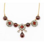 A garnet, diamond and seed pearl 9ct gold necklace, comprising alternate collet set round cabochon