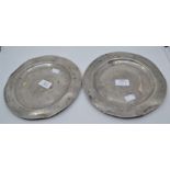 A pair of 18th Century pewter dinner plates stamped with pseudo hallmarks and maker's stamp on