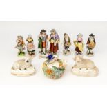 A collection of early 20th Century figures with 19th Century Staffordshire sheep and a pen stand